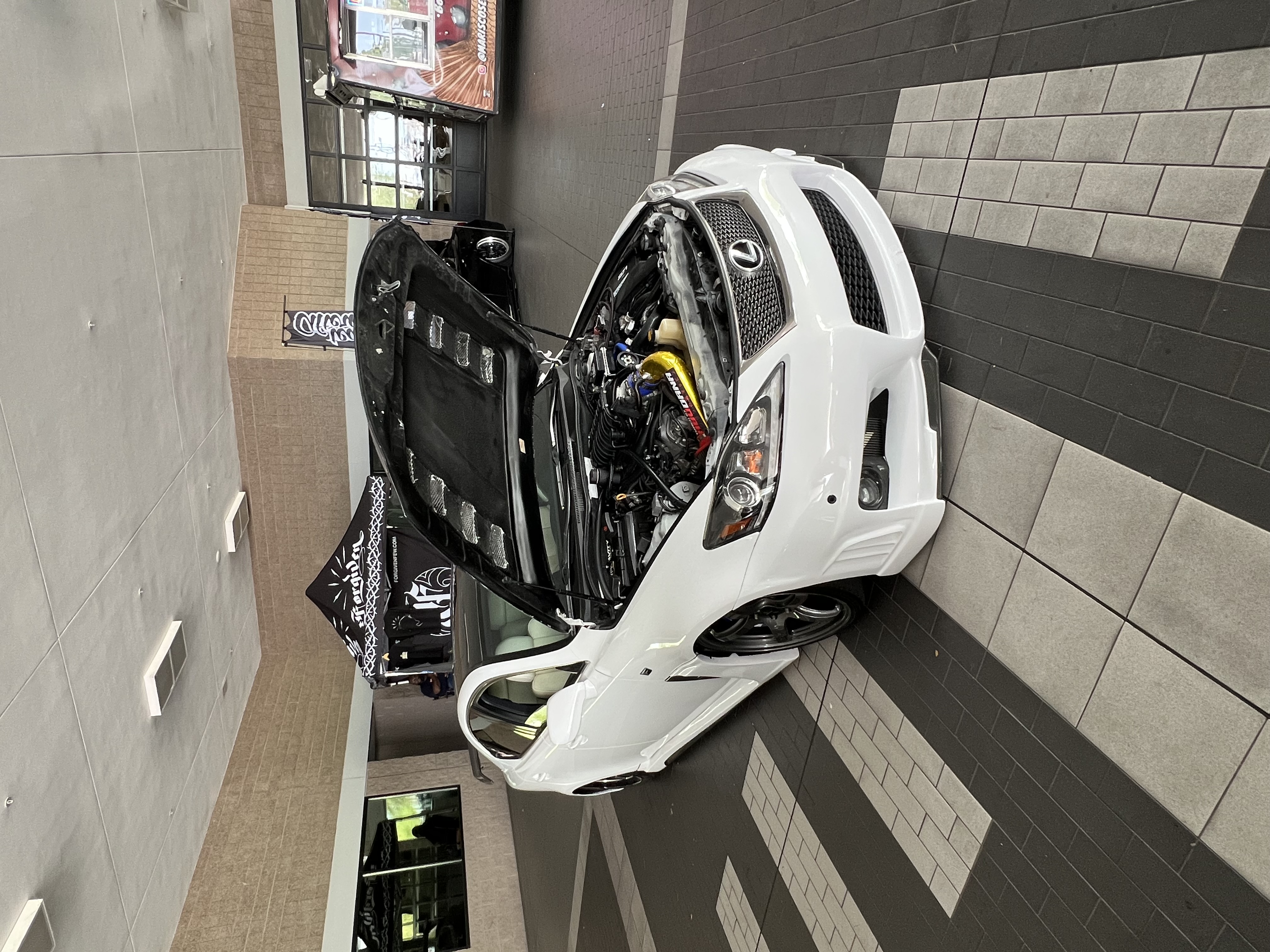 White Lexus IS F with hood open
